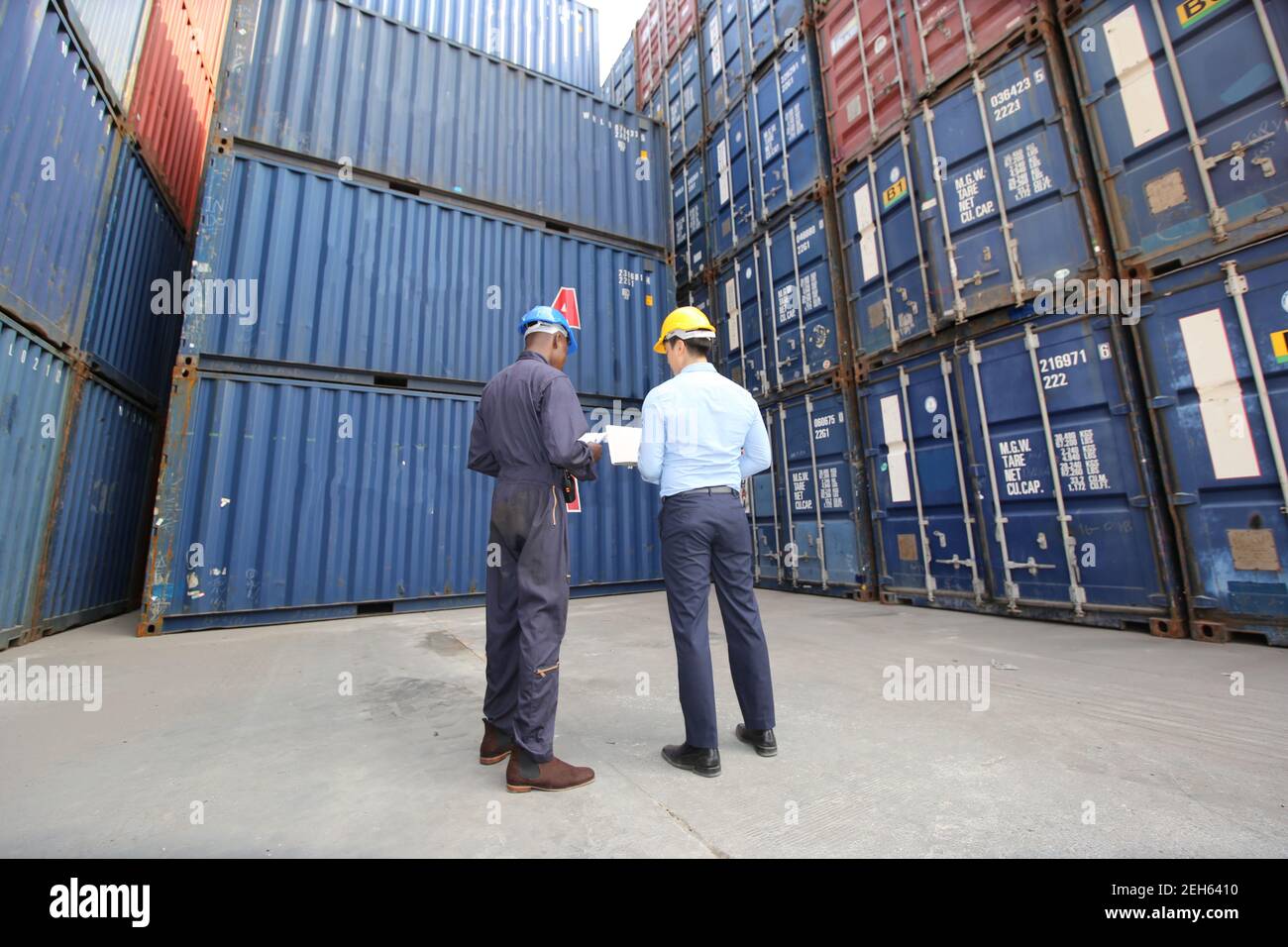 Engineer or supervisor checking and control loading Containers box from ...