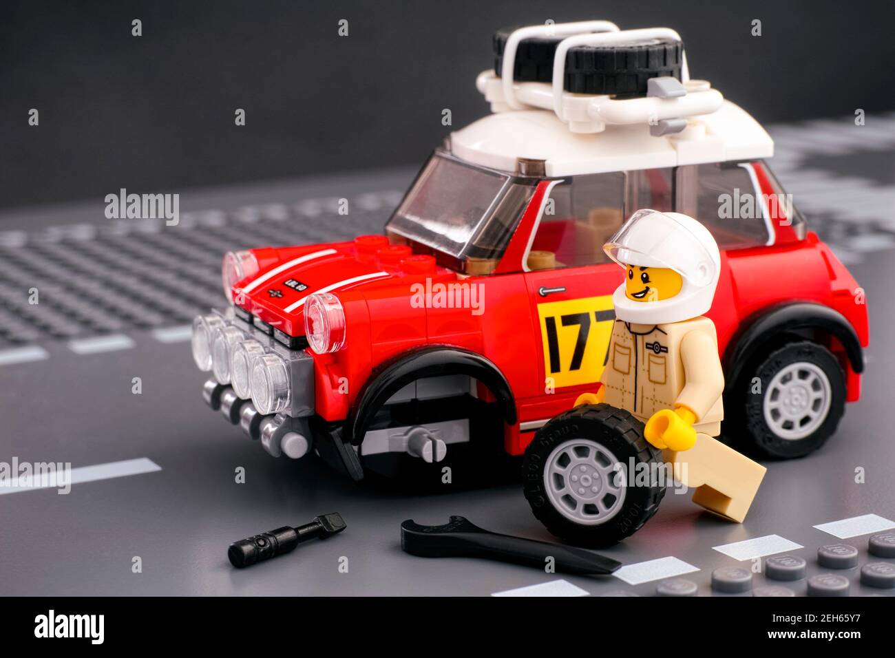 Tambov, Russian Federation - February 14, 2021 Lego driver minifigure is  fixing wheel of 1967 Mini Cooper S Rally car by LEGO Speed Champions on the  L Stock Photo - Alamy