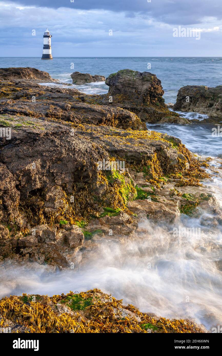Penmon Point lighthouse in the morning sun, Anglesey, North Wales Stock Photo