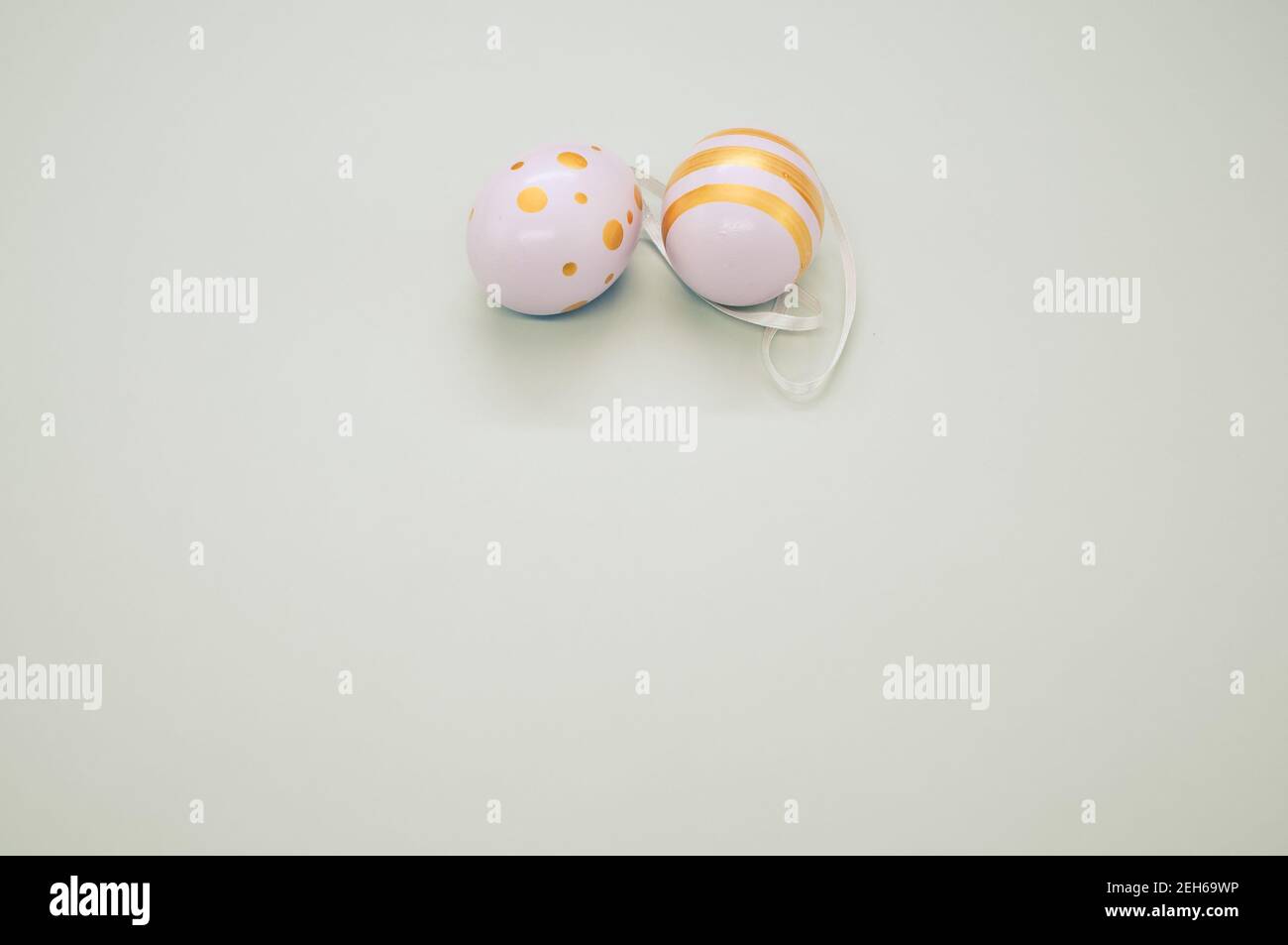 Easter eggs colored with golden paint in different patterns isolated on a white background Stock Photo