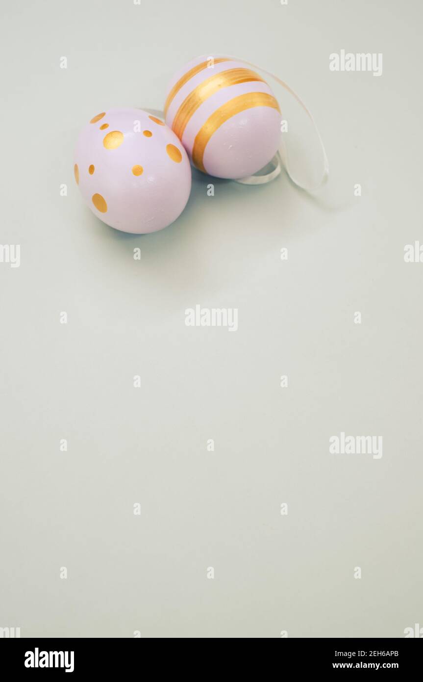 Easter eggs colored with golden paint in different patterns isolated on a white background Stock Photo