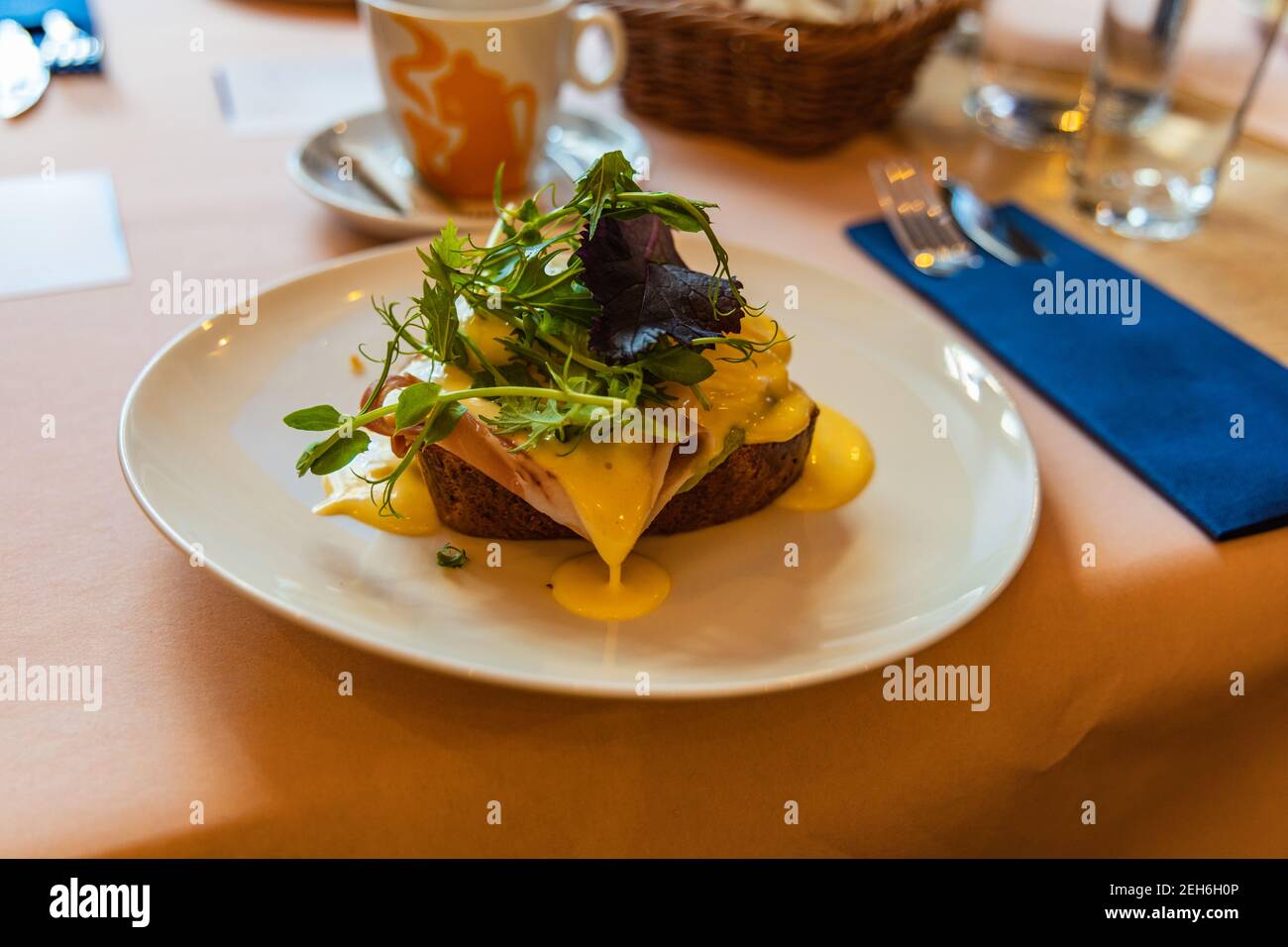 Toast with poached egg ham salad and sauce Stock Photo