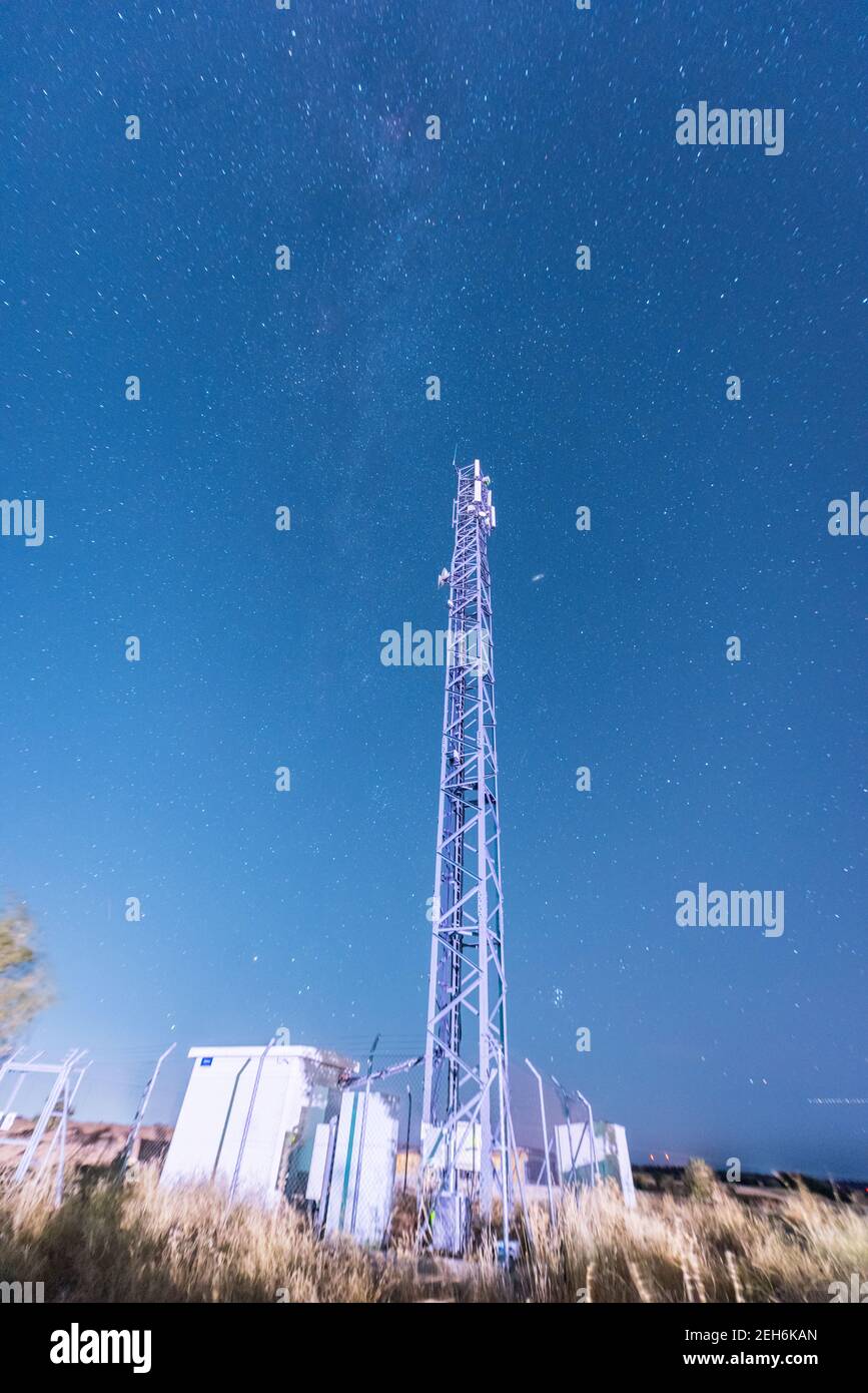 communications antenna under starry sky Stock Photo