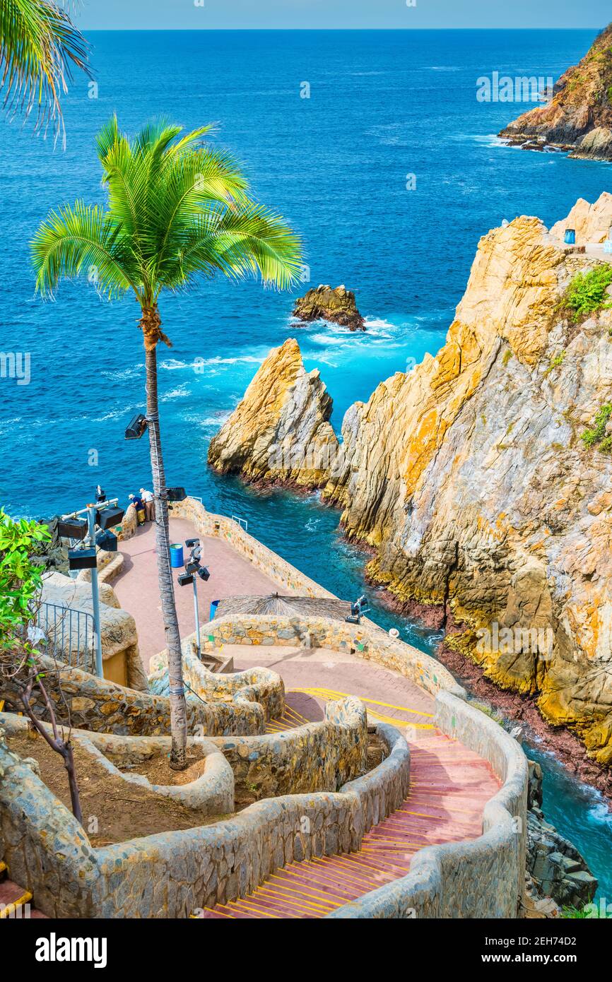 La Quebrada is one of the most famous tourist attractions in Acapulco, Guerrero, Mexico. Divers entertain tourists by jumping off of the cliff. Stock Photo