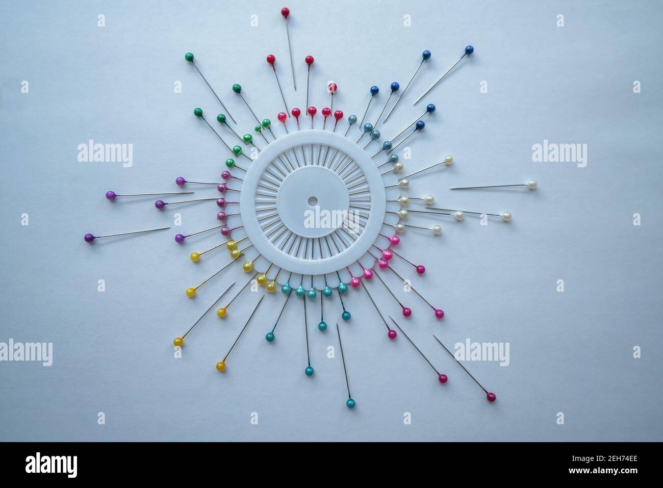 abstract representation of round diagram with basting needles on white background Stock Photo