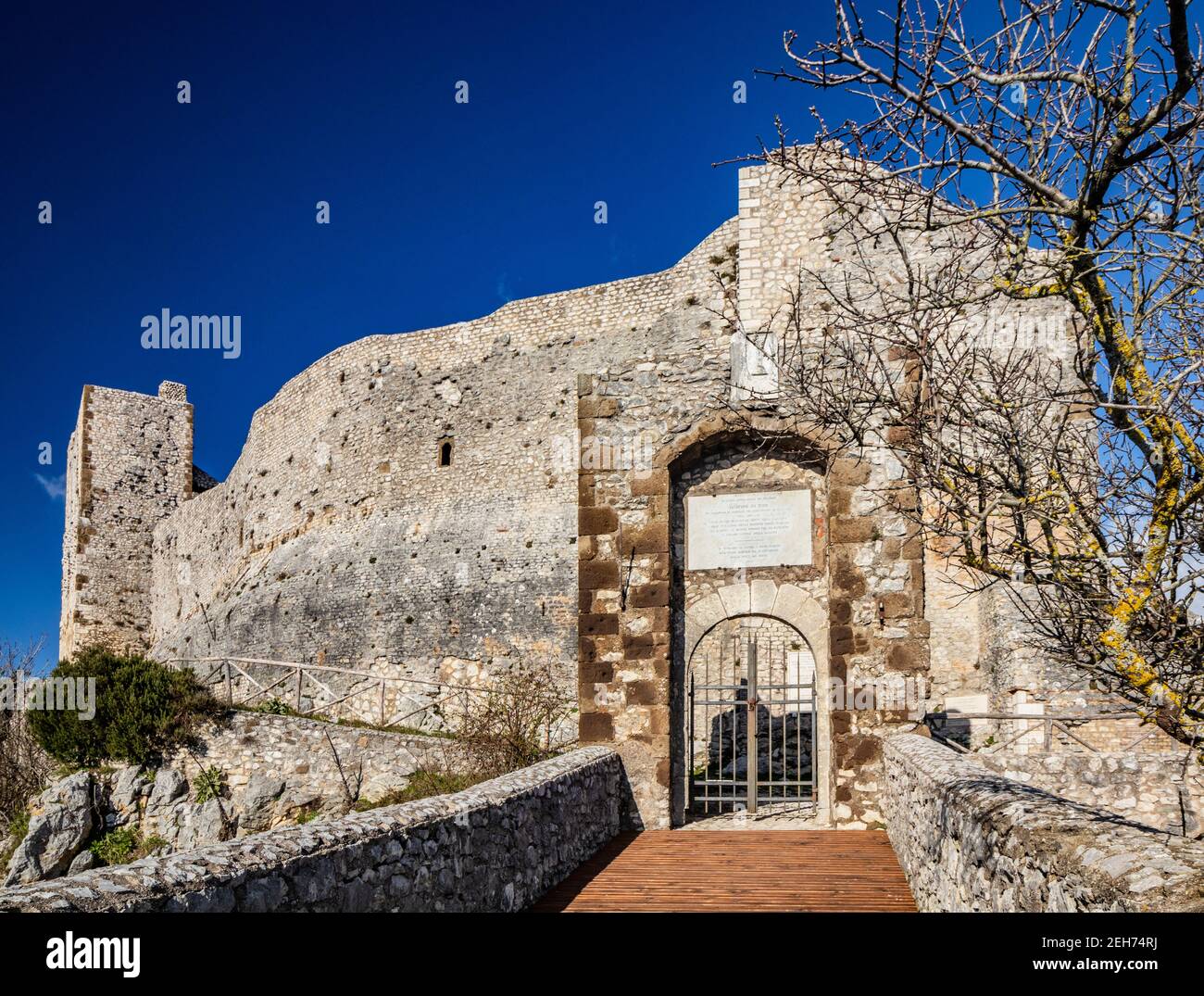 The small medieval village of Castel San Pietro Romano, Lazio, province of Rome, Palestrina. The ancient entrance to the castle with the bridge and ga Stock Photo