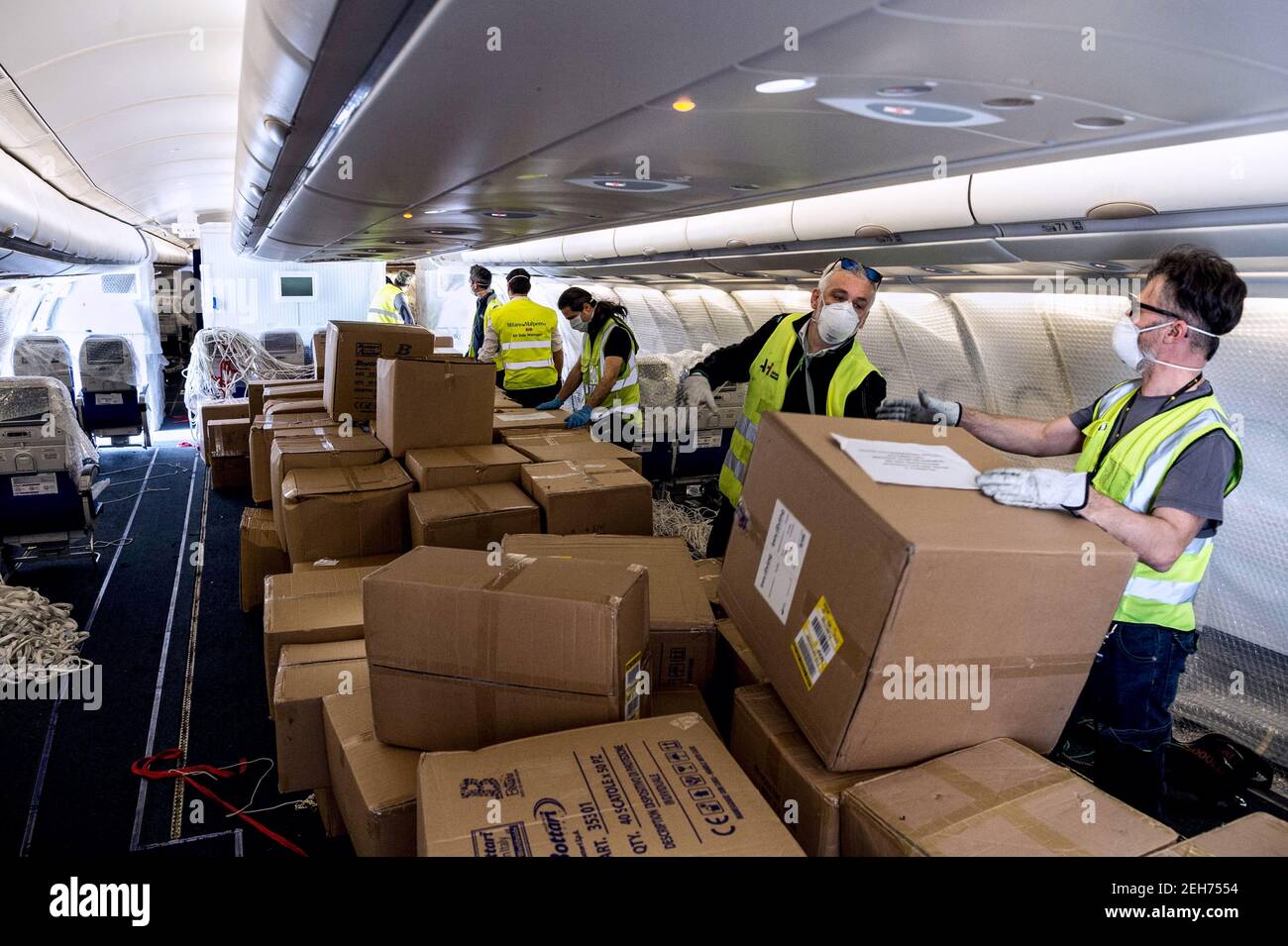 Milan, Italy. 19th Feb, 2021. Milan March 2020, Milan Malpensa airport, masks from China arriving on airliners transformed into cargo planes Editorial Usage Only Credit: Independent Photo Agency/Alamy Live News Stock Photo