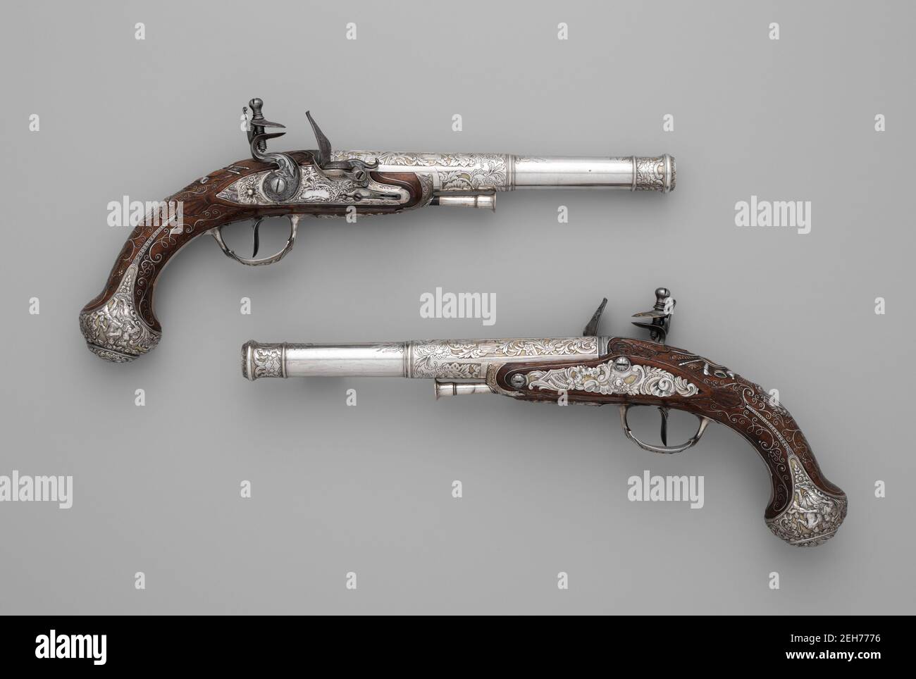Pair of Flintlock Pistols, Indian, Lucknow, and possibly British, London, ca. 1786. Markings indicate the pistols were made in the Arsenal at Lucknow, India, under direction of Arsenal Superintendent Claude Martin. Stock Photo