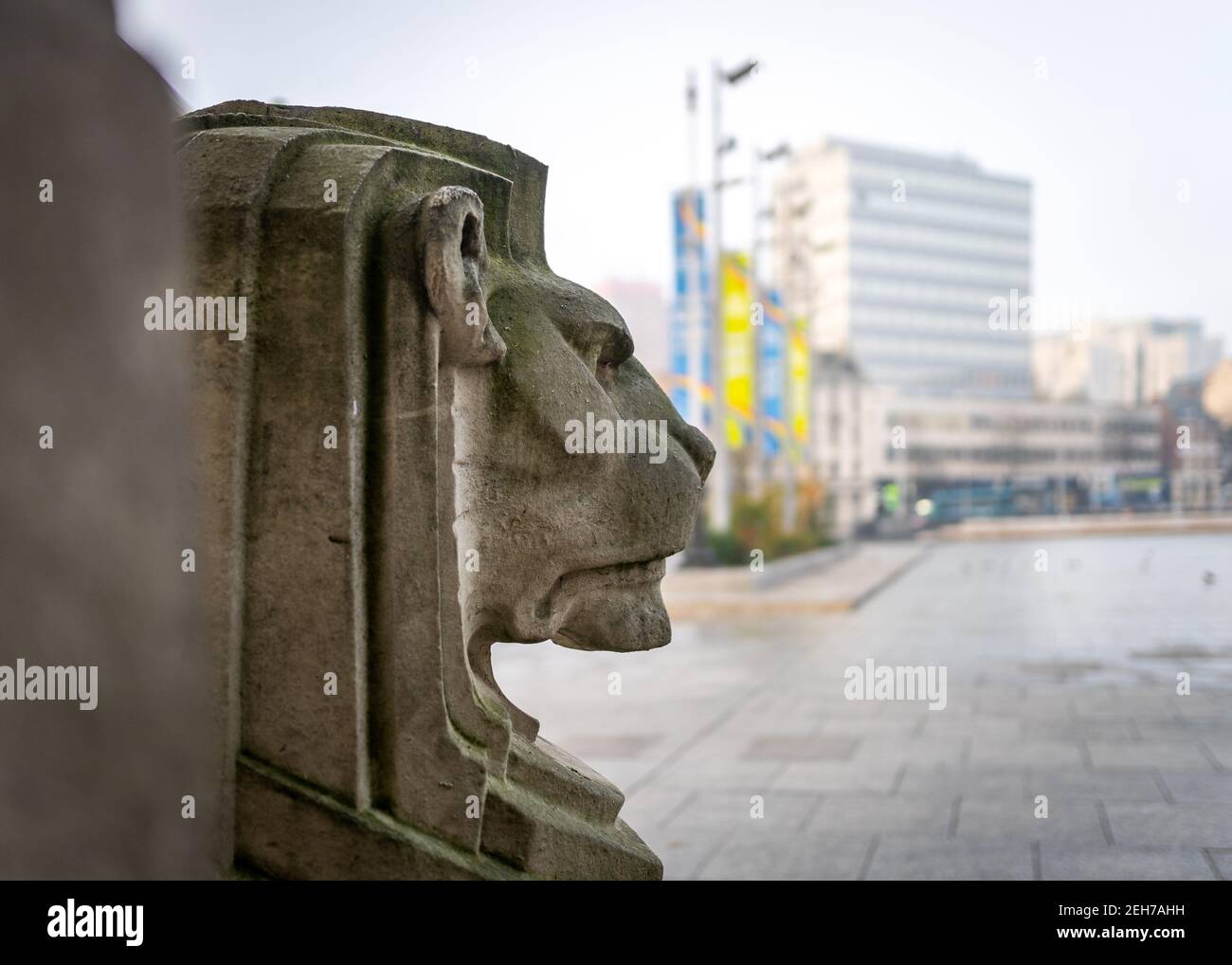 Nottingham city deserted empty market square on foggy morning during Covid 19 pandemic lockdown stone carved lion outside council house office block Stock Photo
