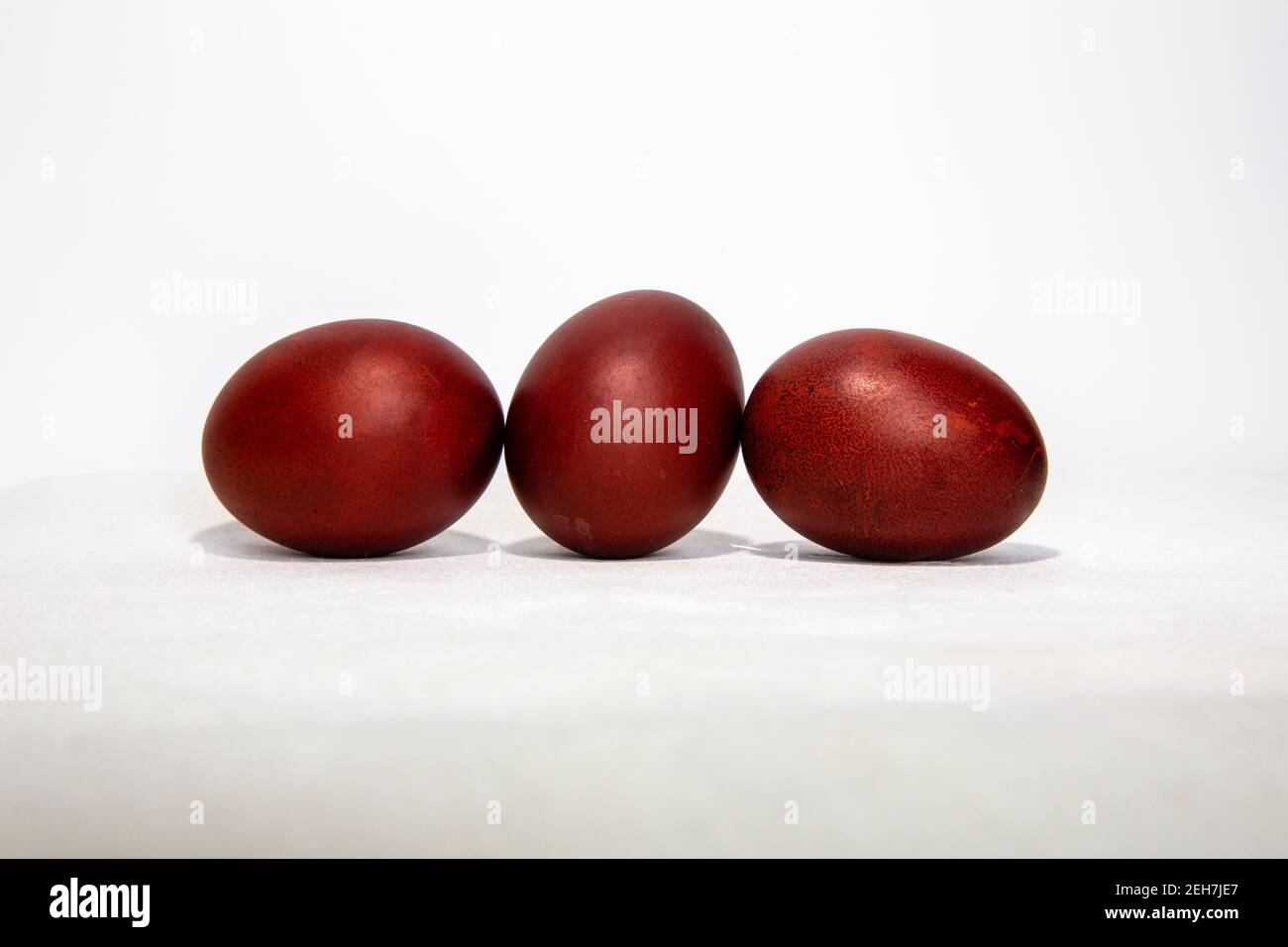 three colored for Easter eggs on white background Stock Photo