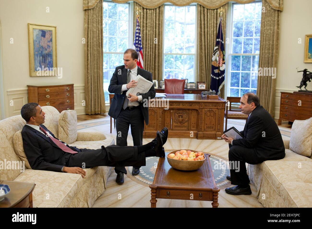 President Barack Obama talks with Deputy National Security Advisor for Strategic Communication Ben Rhodes and Senior Advisor David Axelrod in the Oval Office, May 21, 2010. Stock Photo