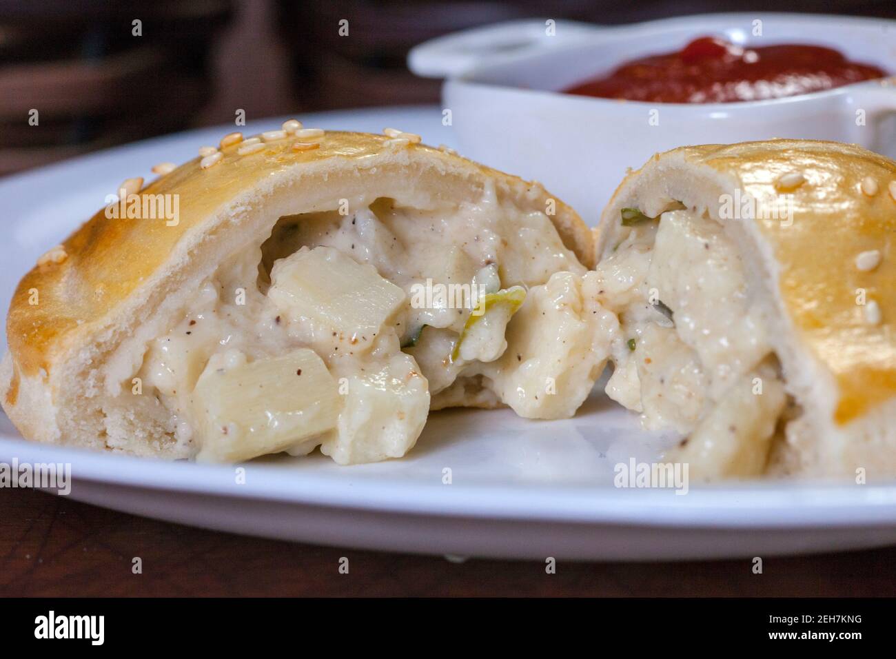 Brazilian snacks, roasted pastel with heart of palm filling Stock Photo