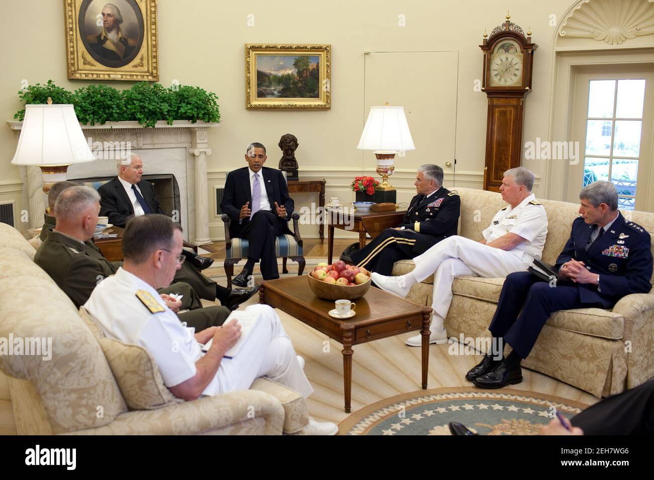 President Barack Obama meets with Defense Secretary Robert Gates and the Joint Chiefs of Staff in the Oval Office, June 21, 2010. Pictured, clockwise from the President, are Army Chief of Staff Gen. George W. Casey, Jr., Chief of Naval Operations Admiral Gary Roughhead, Chief of Staff of the Air Force Gen. Norton S. Schwartz, Chairman of the Joint Chiefs of Staff Admiral Michael Mullen, Commandant of the Marine Corps Gen. James T. Conway, and Gen. James Cartwright, vice chairman of the Joint Chiefs of Staff. Stock Photo
