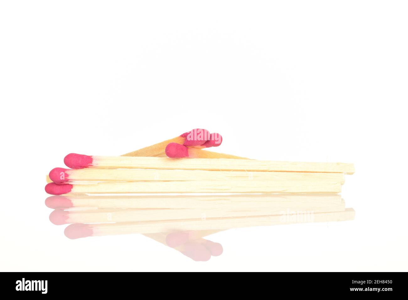 Several wooden matches, close-up, on a white background. Stock Photo