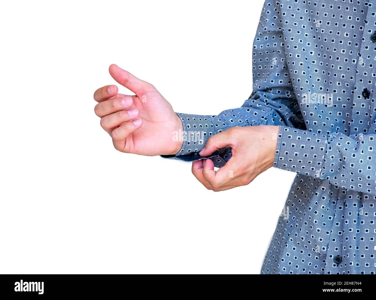 Young arabic guy doing his buttons Stock Photo - Alamy