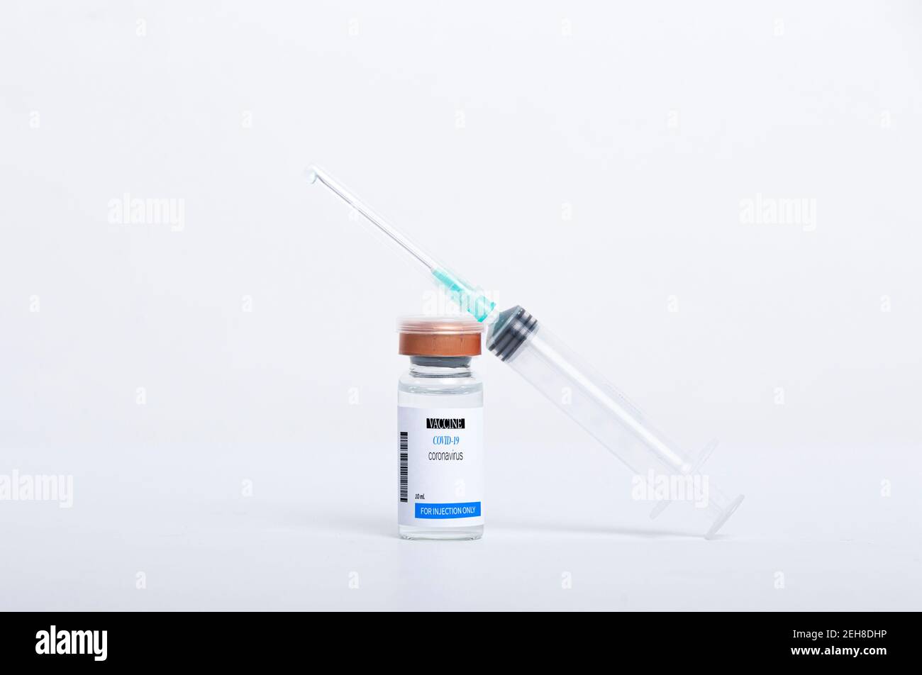 Covid -19 vaccine vial and syringe for injection isolated on white ...
