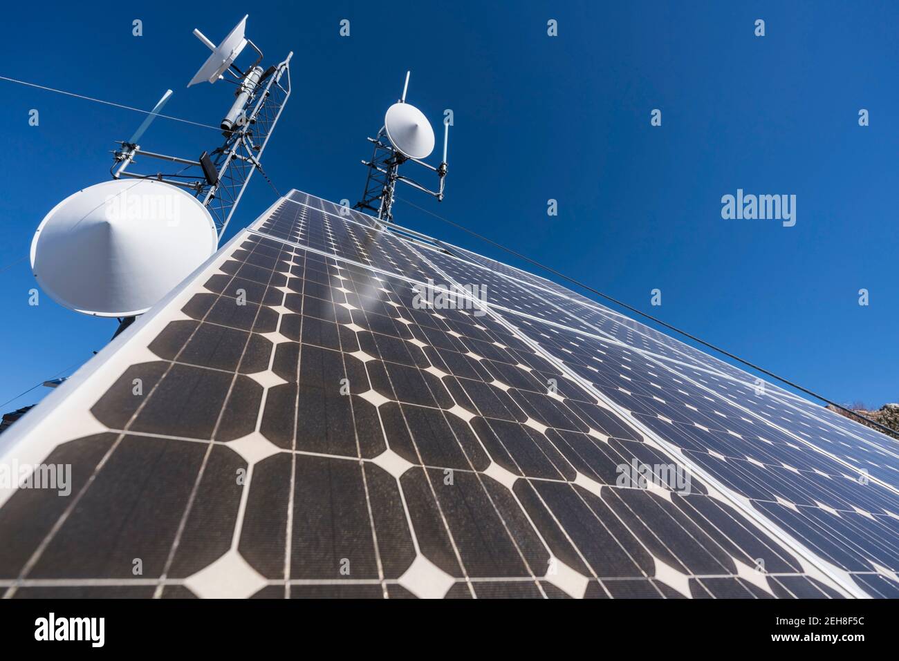 Solar panels powering mountain peak communications equipment in the Angeles National Forest and San Gabriel Mountains near Los Angeles, California. Stock Photo