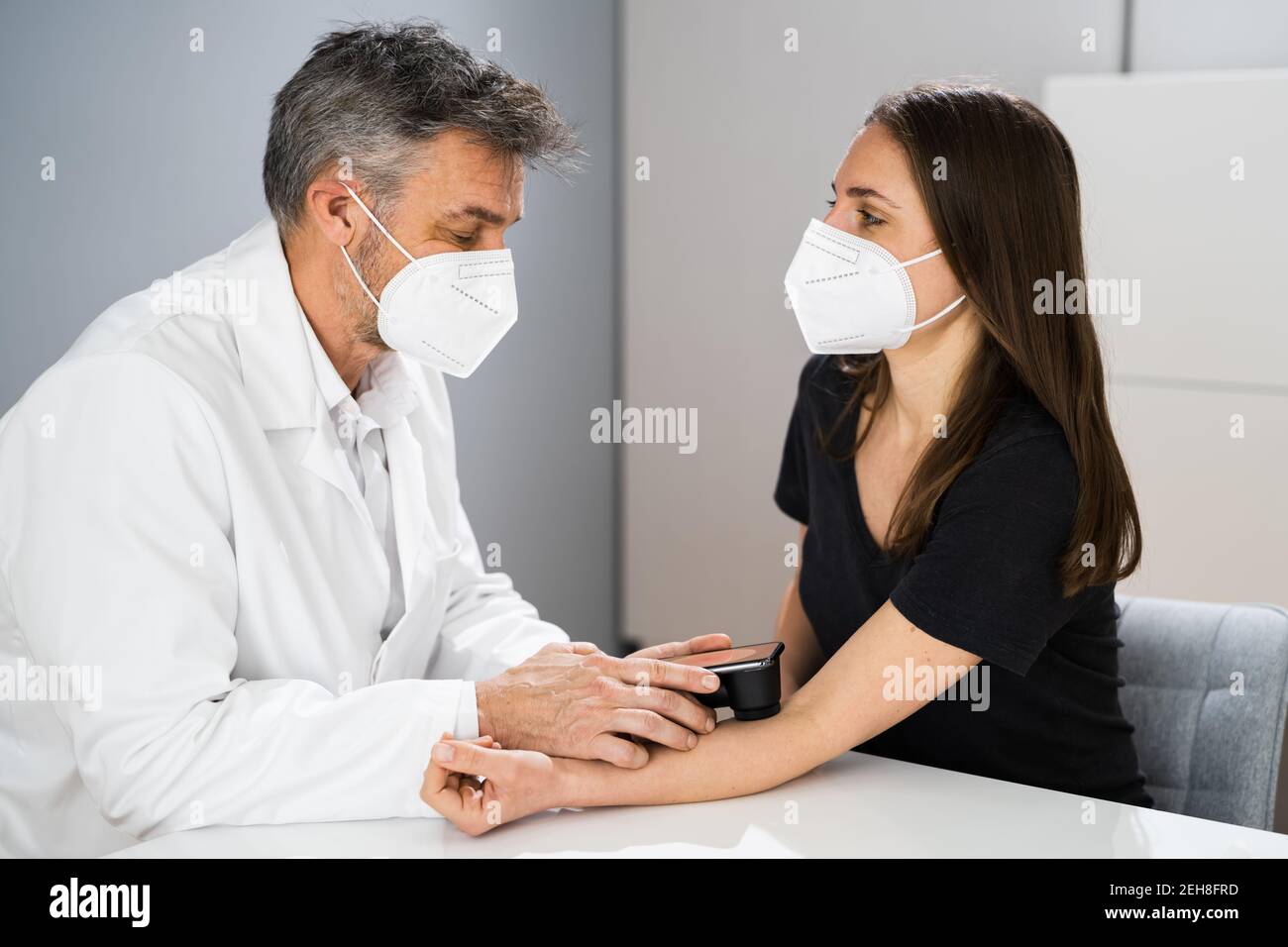 Doctor Examining Pigmented Skin Of Patient Woman Stock Photo