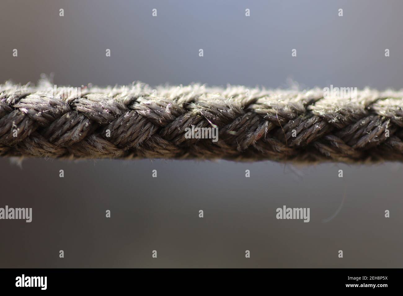 thick braided rope near, fiber rope Stock Photo Alamy