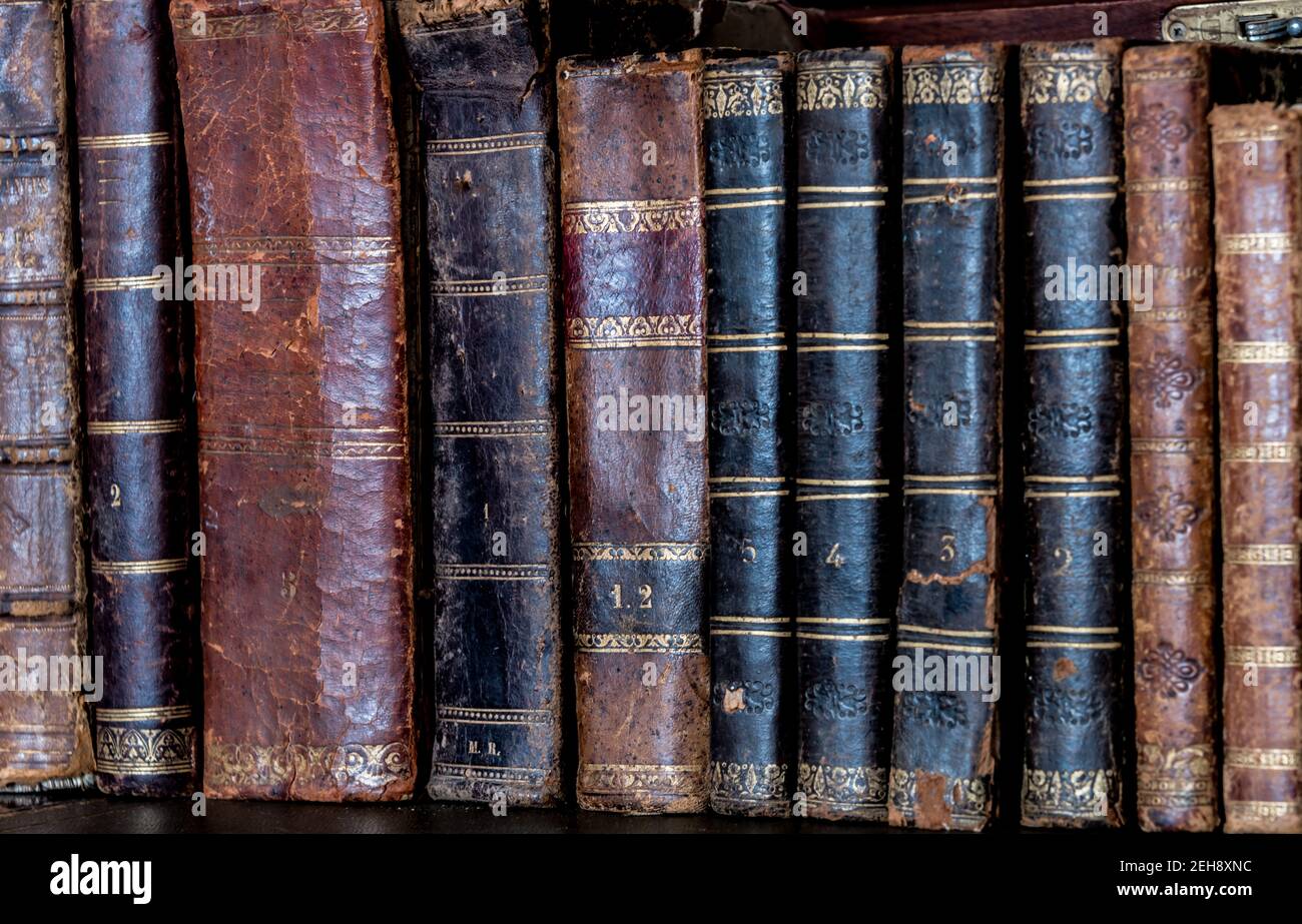 old books placed on wooden shelf Stock Photo - Alamy