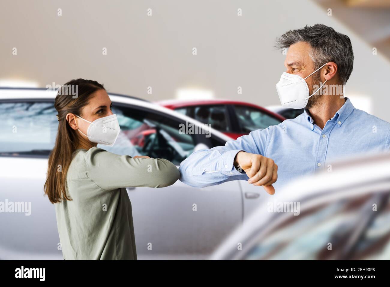 Buyer In Car Dealership Wearing Face Mask Stock Photo