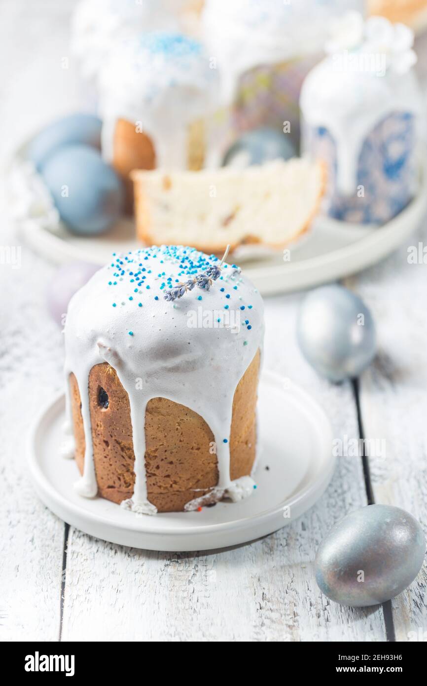 Easter table with Easter cakes and Easter eggs over white background Stock Photo