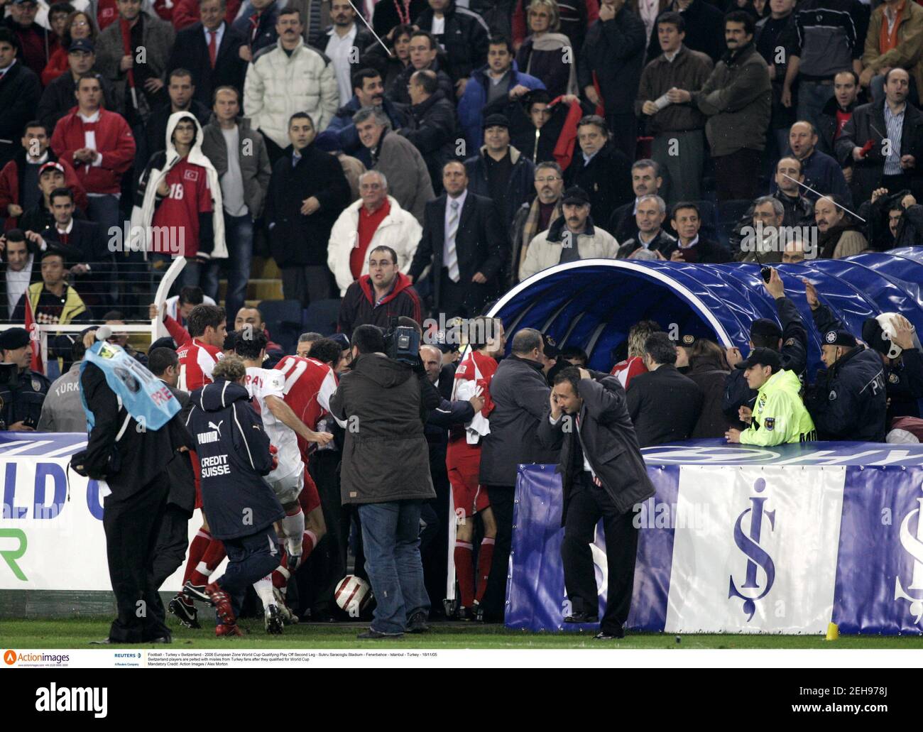 Football - Turkey v Switzerland - 2006 European Zone World Cup Qualifying Play Off Second Leg - Sukru Saracoglu Stadium - Fenerbahce - Istanbul - Turkey - 16/11/05 Switzerland players are pelted with misiles from Turkey fans after they qualified for World Cup Mandatory Credit: Action Images / Alex Morton Stock Photo