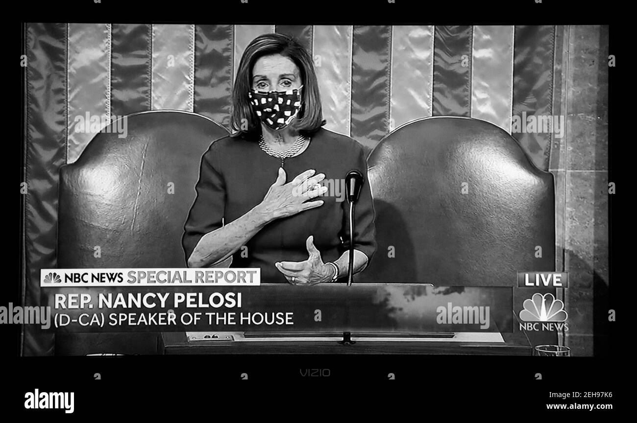 A PBS NewsHour screenshot House Speaker Nancy Pelosi addressing the Senate minutes before supporters of President Trump attacked the U.S. Capitol. Stock Photo