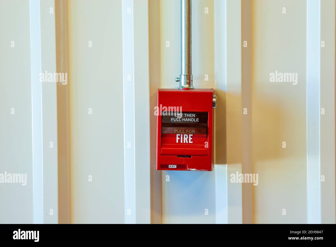 Fire alarm switch to pull in case of fire Stock Photo
