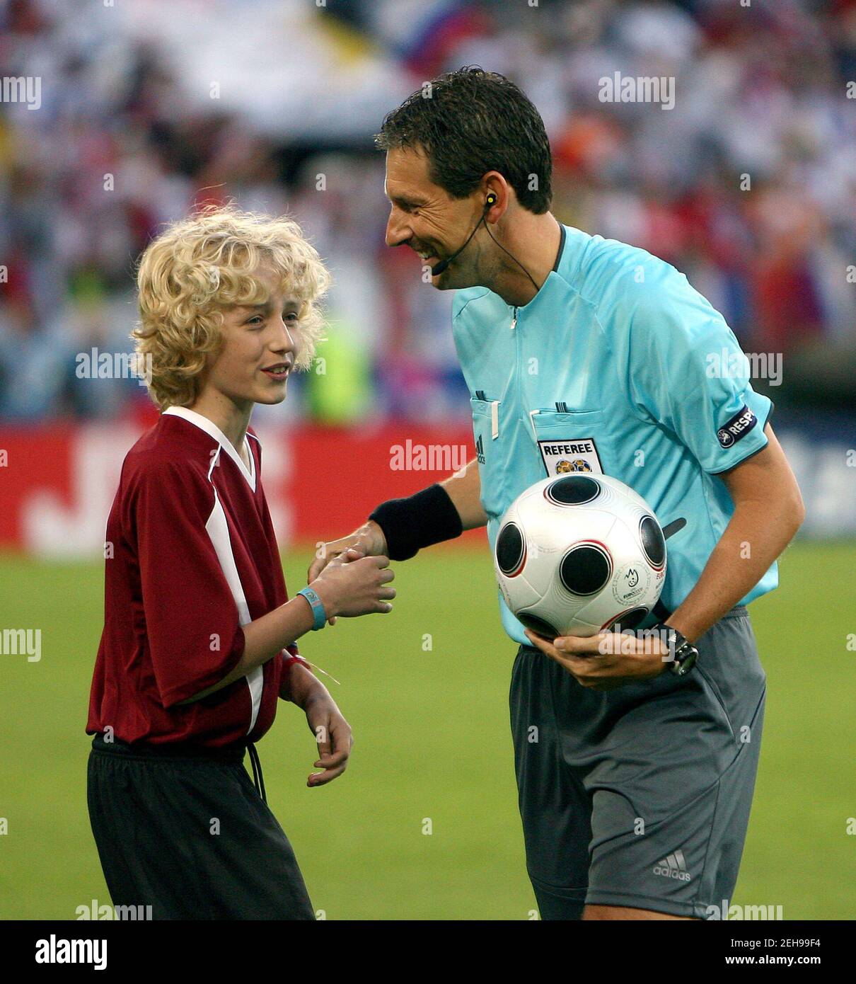 Football - Russia v Sweden UEFA EURO 2008 Group D - Tivoli-Neu Stadium,  Innsbruck, Austria - 18/6/08. Belgum referee Frank De Bleeckere receives  the match ball from the Kia match ball child