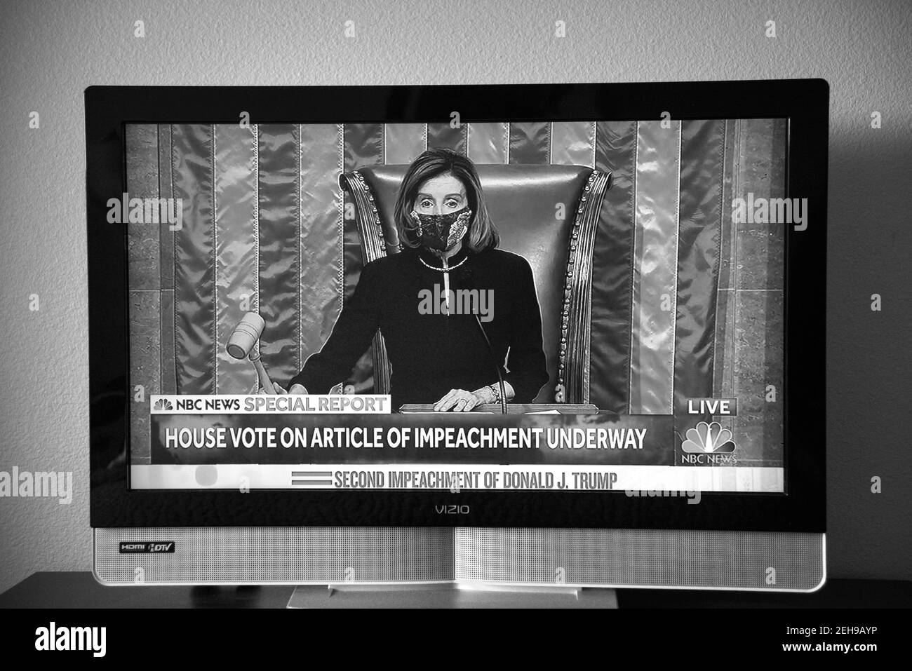 TV screen shot of a live NBC live broadcast with House Speaker Nancy Pelosi overseeing the vote to impeach President Donald Trump for the second time. Stock Photo