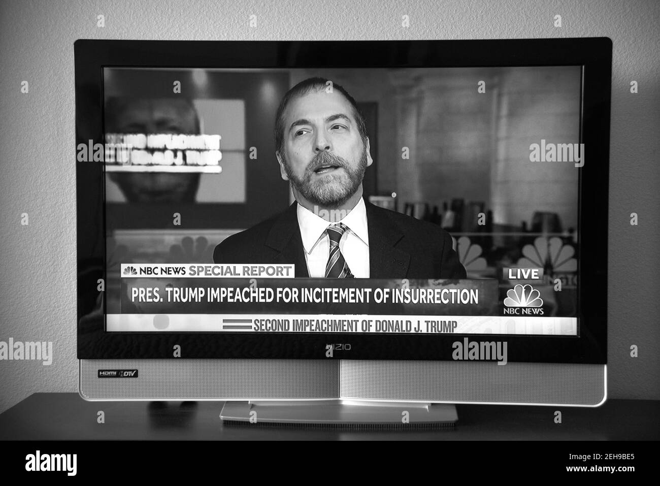 A television screenshot of NBC news reporter Chuck Todd announcing that U.S.President Donald Trump was impeached for the second time. Stock Photo