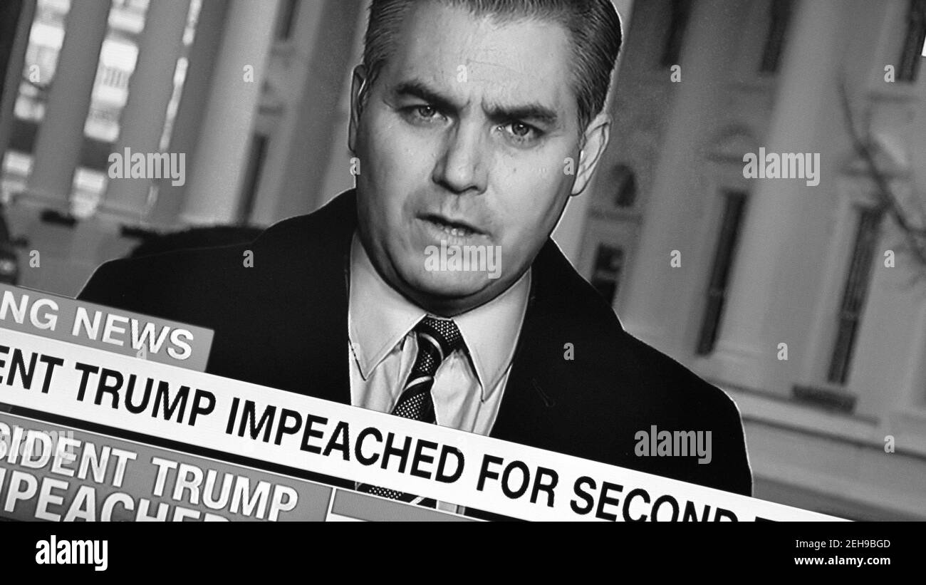A CNN screenshot of news correspondent Jim Acosta announcing that President Donald Trump has been impeached for the second time. Stock Photo