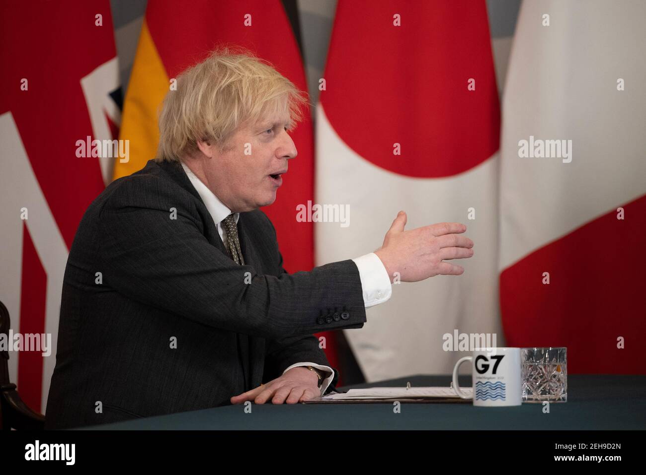 London, UK. 19th Feb 2021.  British Prime Minister Boris Johnson speaks during a virtual meeting of the leaders of the Group of Seven at Downing Street in London, Britain, on Feb. 19, 2021. The leaders of the Group of Seven (G7) on Friday pledged to cooperate with the Group of 20 (G20) and other international institutions on a range of global issues including fighting coronavirus pandemic, climate change and upholding the rules-based multilateral trading system, sending signals that the G7 will be committed to multilateral cooperation. Stock Photo