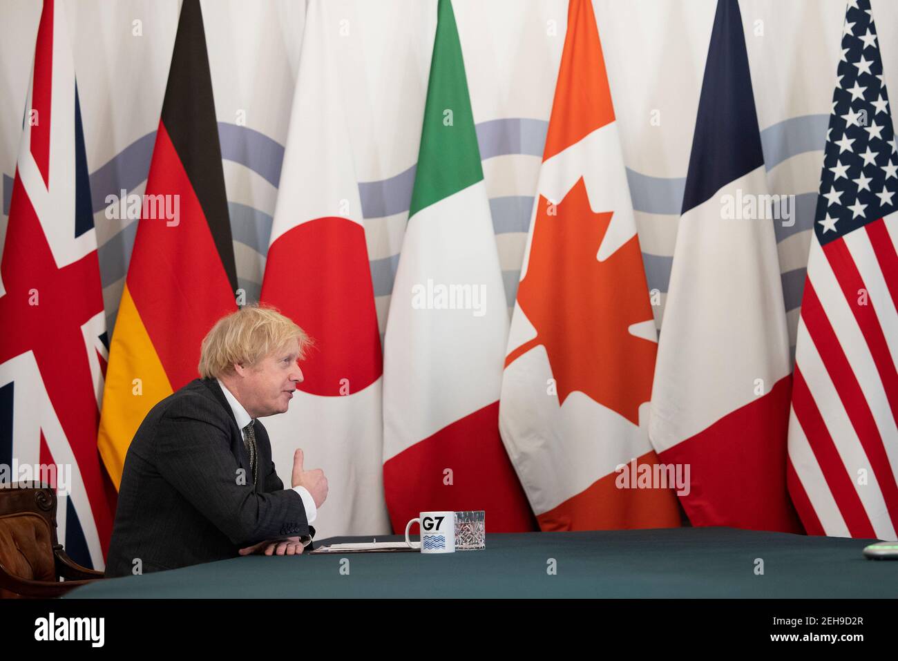 London, UK. 19th Feb 2021.  British Prime Minister Boris Johnson speaks during a virtual meeting of the leaders of the Group of Seven at Downing Street in London, Britain, on Feb. 19, 2021. The leaders of the Group of Seven (G7) on Friday pledged to cooperate with the Group of 20 (G20) and other international institutions on a range of global issues including fighting coronavirus pandemic, climate change and upholding the rules-based multilateral trading system, sending signals that the G7 will be committed to multilateral cooperation. Stock Photo