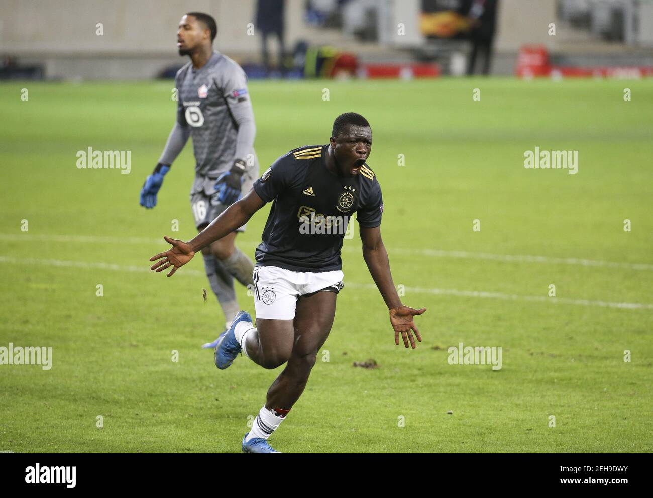 Brian Brobbey of Ajax celebrates his goal while goalkeeper of Lille Mike Maignan is dejected during the UEFA Europa League, roun / LM Stock Photo