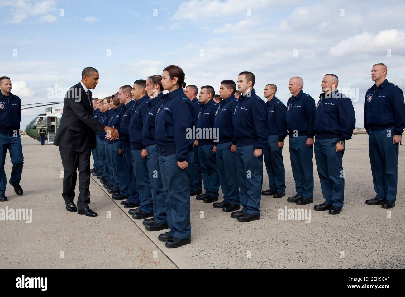 President Barack Obama greets personnel at Joint Base Andrews, Md., before boarding Air Force One, Oct. 25, 2010. Stock Photo