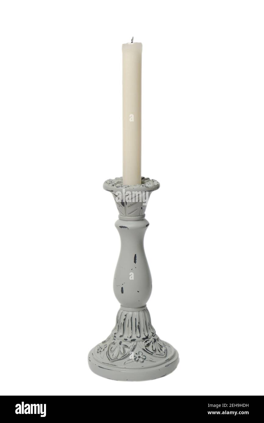 Candle in an old retro candle holder on white background Stock Photo