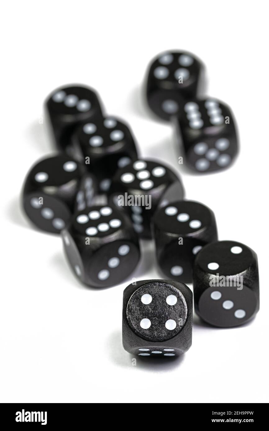 Black game dice against a white background Stock Photo