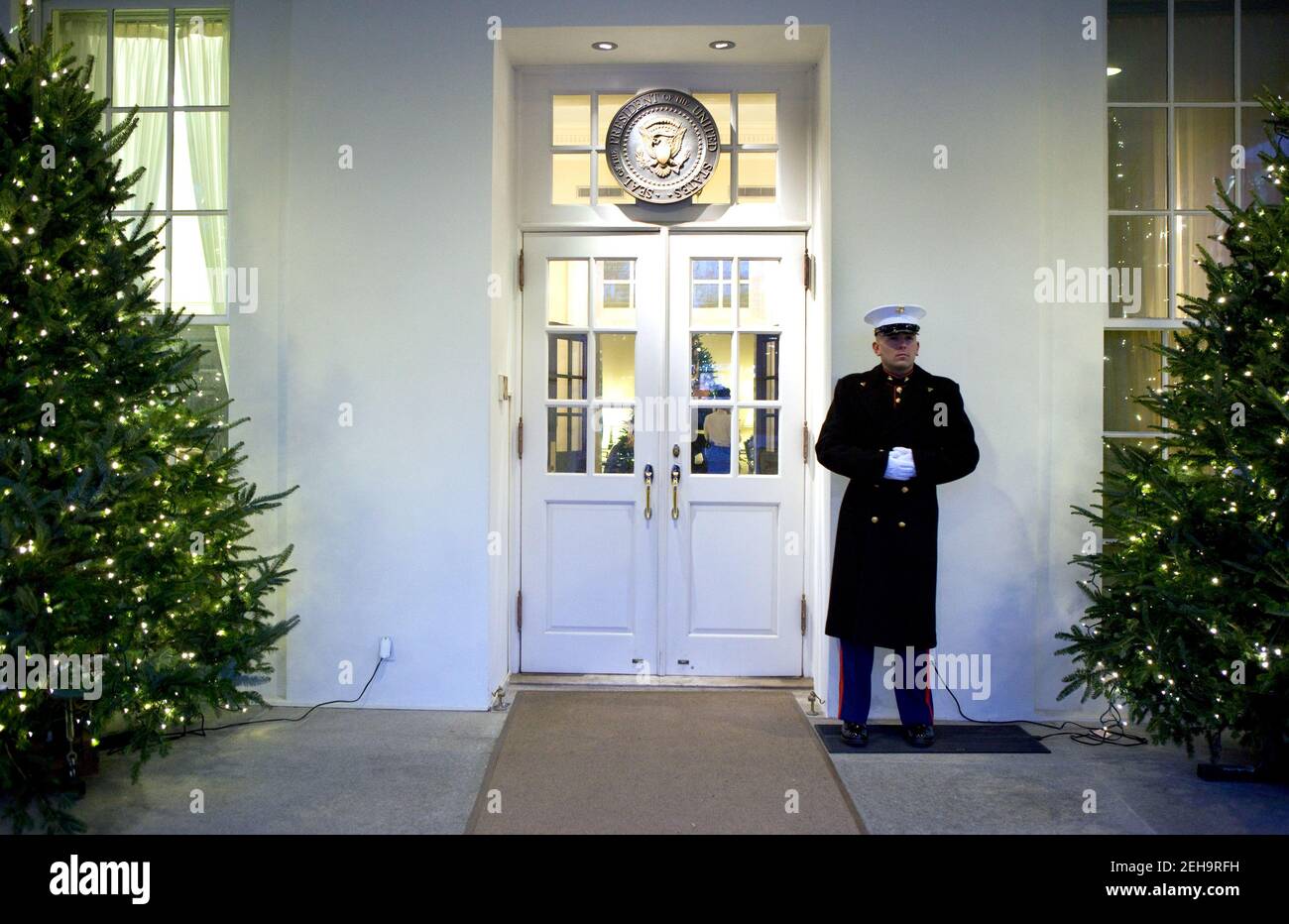 A Marine Sentry stands guard outside the West Wing entrance of the