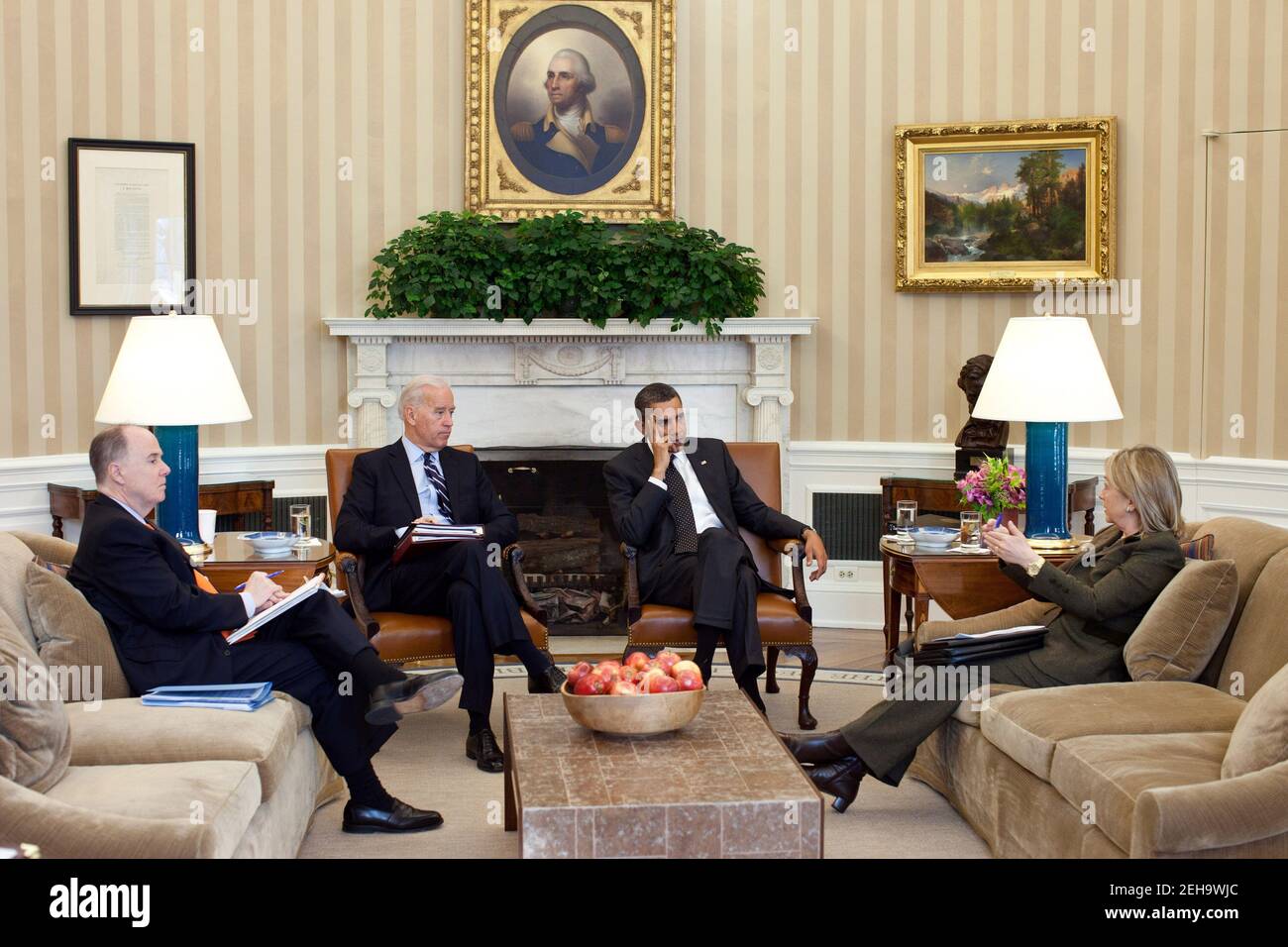 President Barack Obama and Vice President Joe Biden meet with Secretary of State Hillary Rodham Clinton and National Security Advisor Tom Donilon in the Oval Office, Jan. 27, 2011. Stock Photo