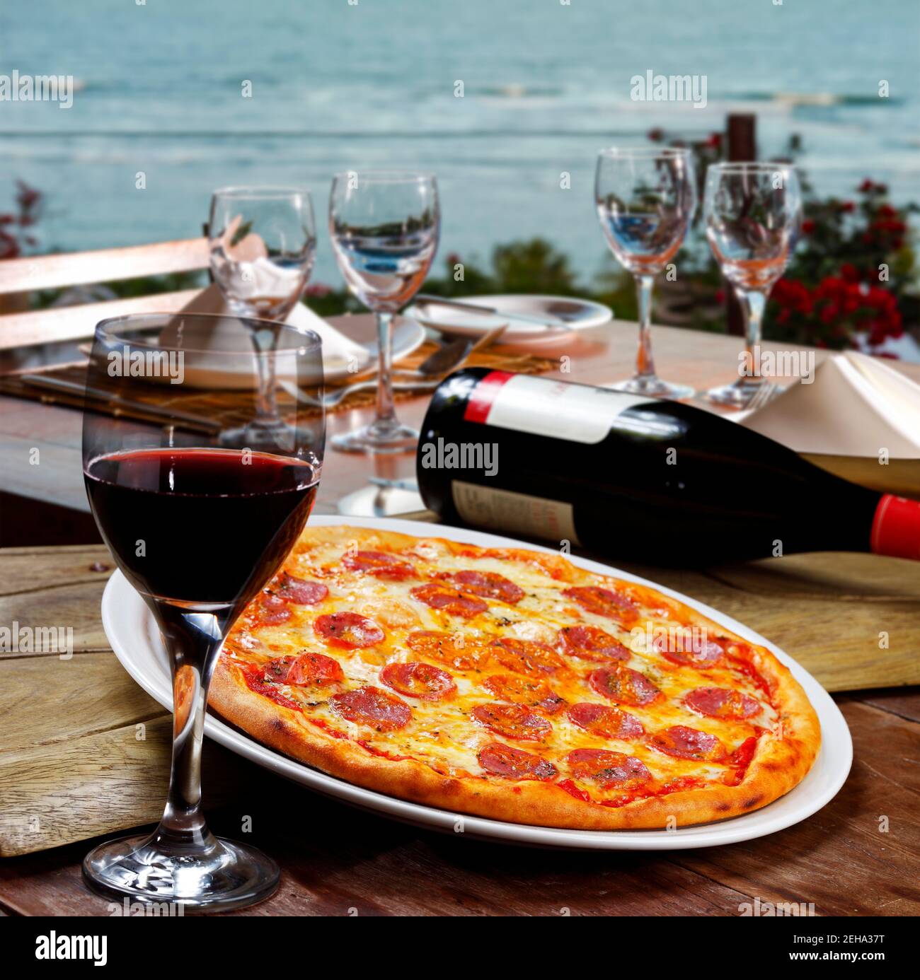 Pepperoni pizza and red wine Stock Photo Alamy
