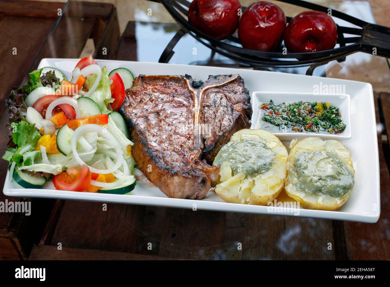 t bone steak with potato salad and vegetables Stock Photo - Alamy