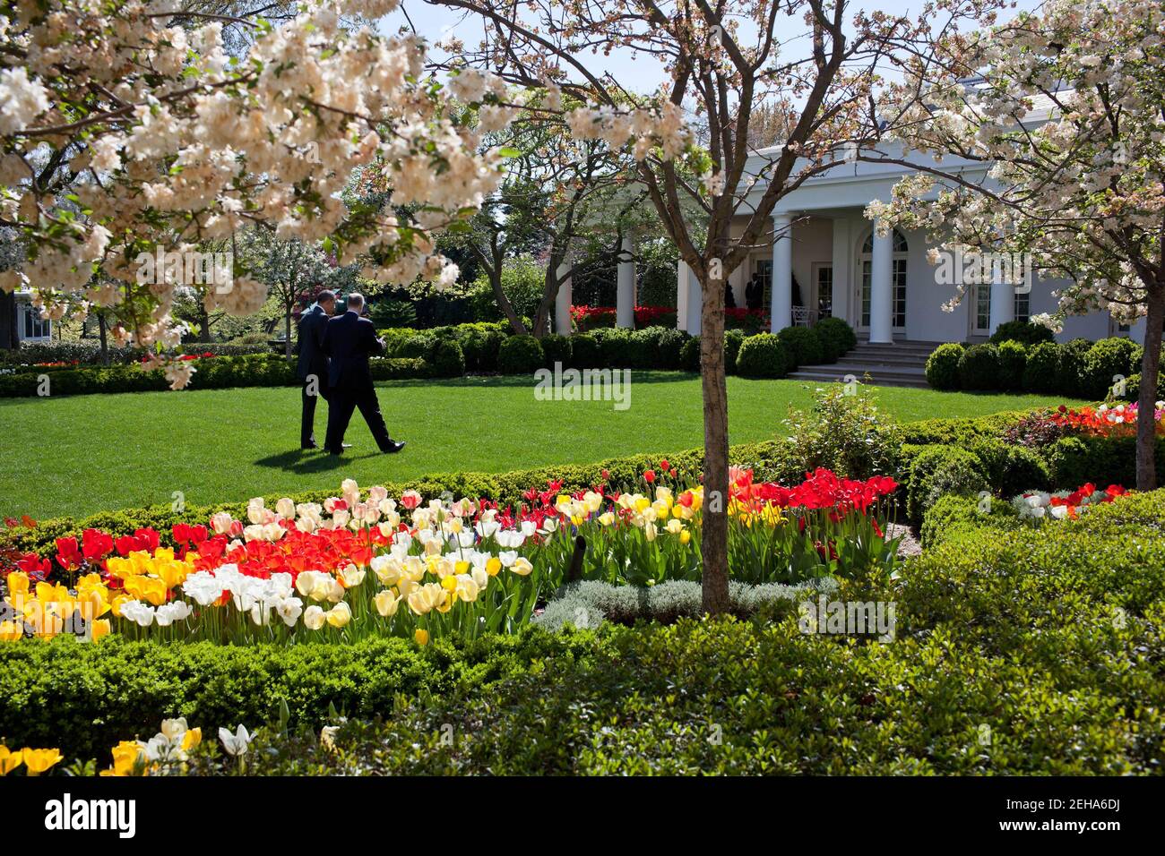 President Barack Obama walks  through the Rose Garden of the White House with National Security Advisor Tom Donilon, April 14, 2011. Stock Photo