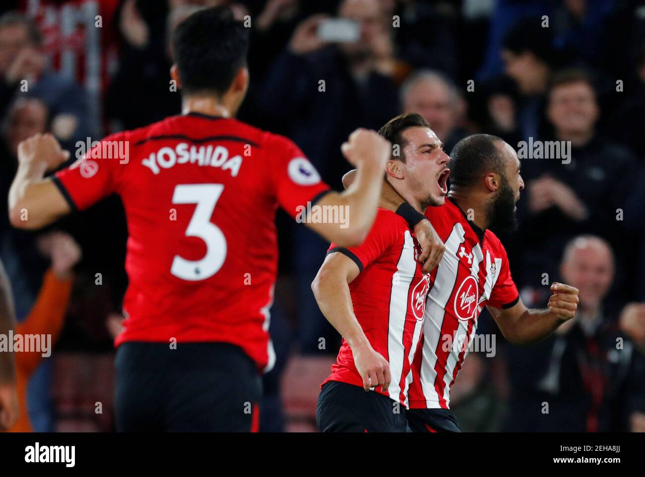 Soccer Football - Premier League - Southampton v Manchester United - St Mary's Stadium, Southampton, Britain - December 1, 2018   Southampton's Cedric Soares celebrates scoring their second goal with Nathan Redmond and Maya Yoshida    REUTERS/Eddie Keogh    EDITORIAL USE ONLY. No use with unauthorized audio, video, data, fixture lists, club/league logos or 'live' services. Online in-match use limited to 75 images, no video emulation. No use in betting, games or single club/league/player publications.  Please contact your account representative for further details. Stock Photo