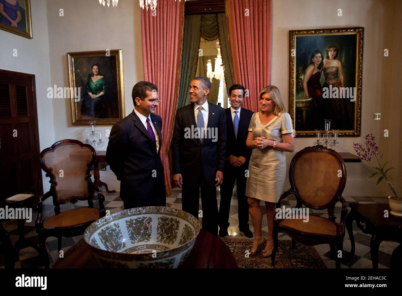 President Barack Obama tours La Fortaleza, the official residence of the Governor of Puerto Rico, with Rep. Pedro Pierluisi, left,  Gov. Luis Fortuño, and First Lady Lucé Vela de Fortuño in San Juan, Puerto Rico, June 14, 2011. Stock Photo