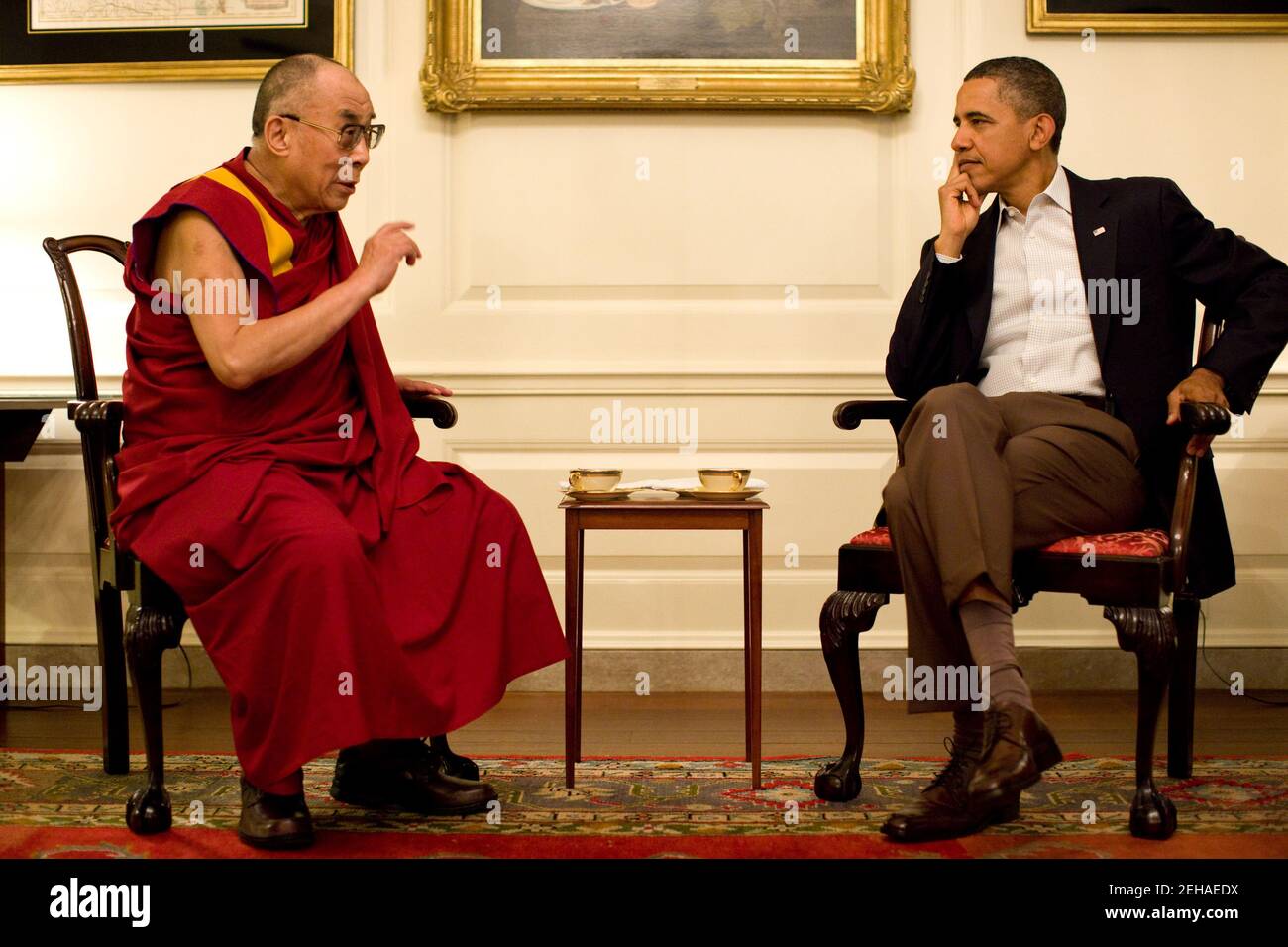 President Barack Obama meets with His Holiness the XIV Dalai Lama in the Map Room of the White House, Saturday, July 16, 2011. Stock Photo
