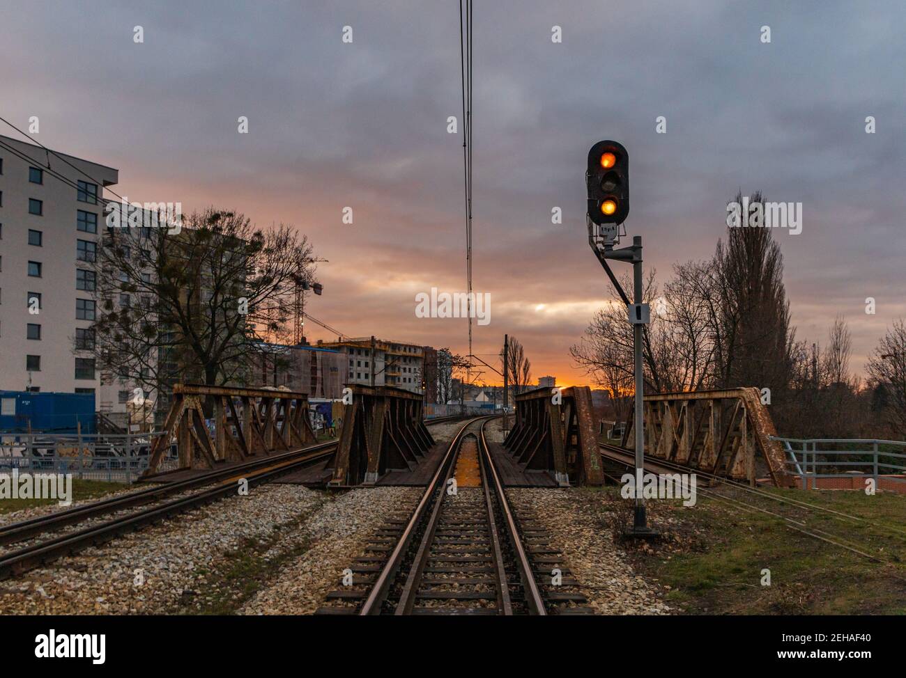 Wroclaw January 10 2020 Train traffic light in front of small railway bridges Stock Photo
