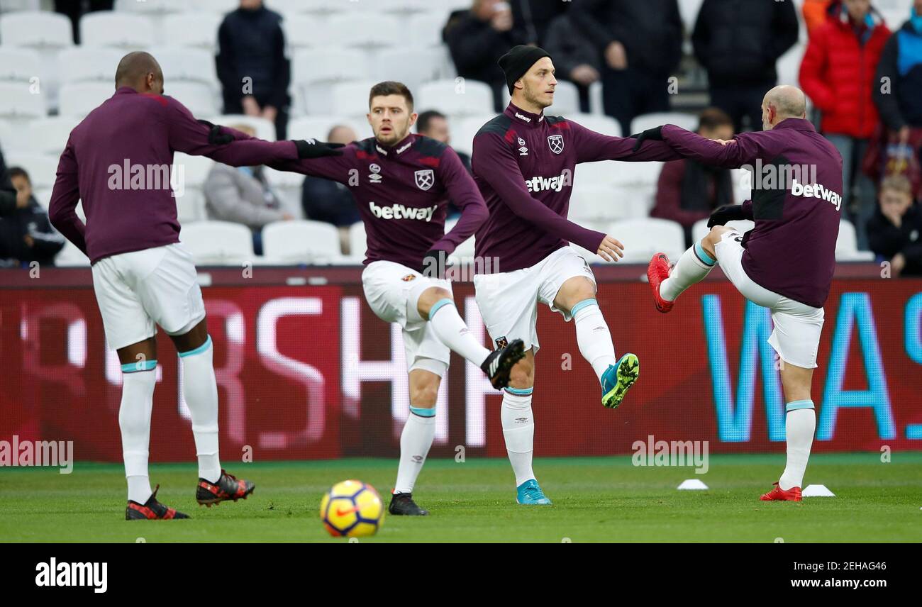 Soccer Football - Premier League - West Ham United vs Newcastle United - London Stadium, London, Britain - December 23, 2017   West Ham United's Marko Arnautovic, Aaron Cresswell and team mates during the warm up before the match    REUTERS/Eddie Keogh    EDITORIAL USE ONLY. No use with unauthorized audio, video, data, fixture lists, club/league logos or 'live' services. Online in-match use limited to 75 images, no video emulation. No use in betting, games or single club/league/player publications.  Please contact your account representative for further details. Stock Photo