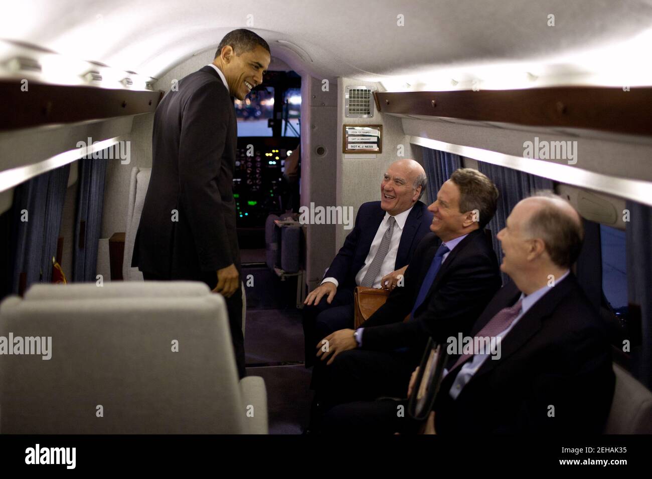 President Barack Obama talks with Chief of Staff Bill Daley, Treasury Secretary Timothy Geithner, and National Security Advisor Tom Donilon aboard Marine One en route to Joint Base Andrews, Md., Nov. 2, 2011. Stock Photo